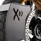 Close-up of a Fortlox Moto X19 Motorcycle Wheel Lock with 'X19' branding on a metallic guard.