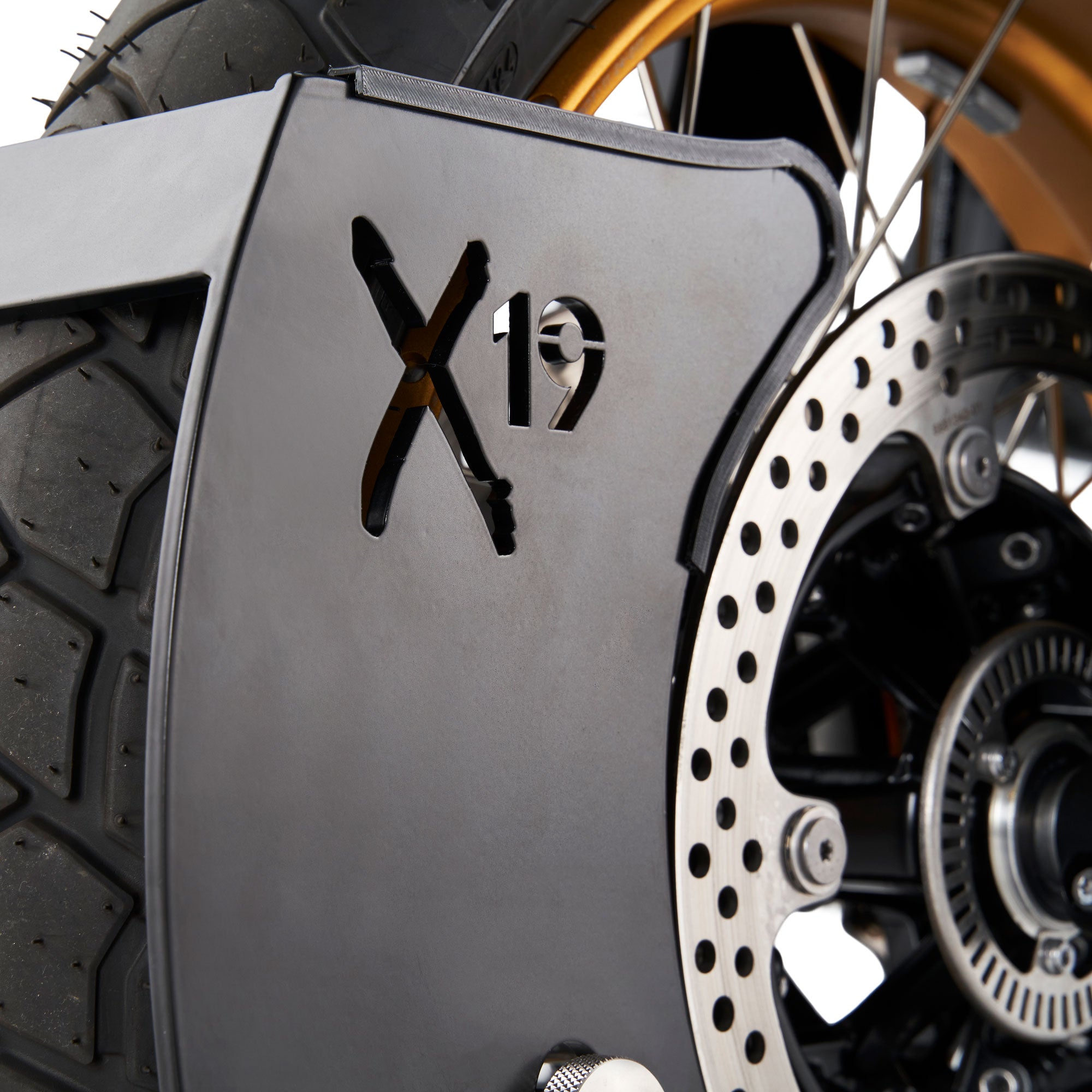 Close-up of a Fortlox Moto X19 Motorcycle Wheel Lock with 'X19' branding on a metallic guard.
